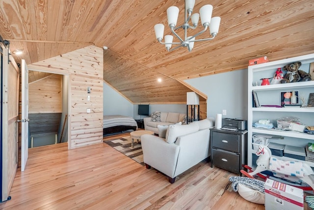 living area featuring a notable chandelier, wood finished floors, a barn door, wood ceiling, and vaulted ceiling