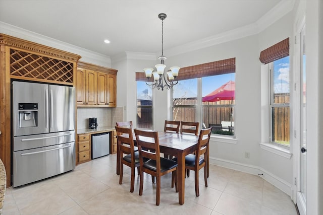 dining room with recessed lighting, an inviting chandelier, crown molding, light tile patterned floors, and baseboards