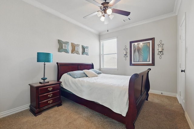 bedroom with visible vents, light carpet, ornamental molding, baseboards, and ceiling fan