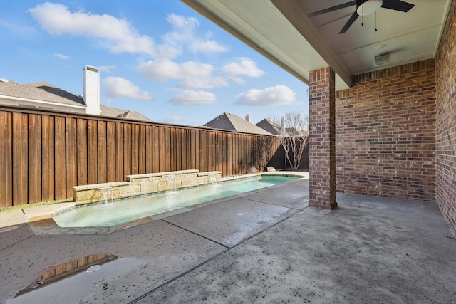 view of swimming pool with a patio area, ceiling fan, a fenced backyard, and a fenced in pool