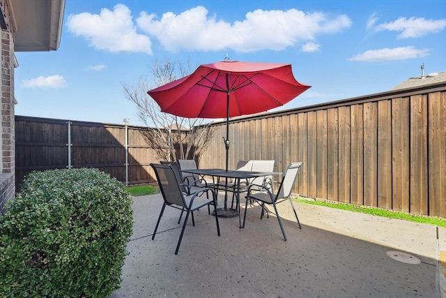 view of patio / terrace featuring a fenced backyard and outdoor dining space