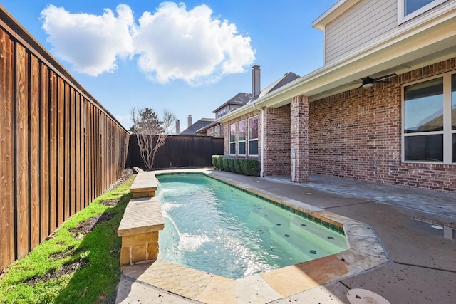 view of pool with a patio area and a fenced backyard