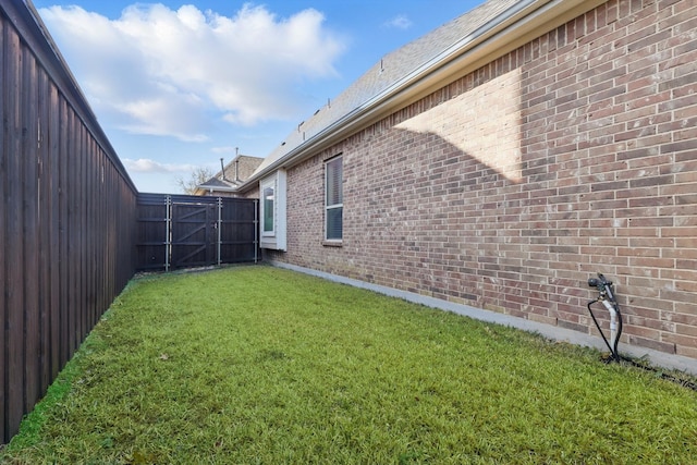 view of yard featuring a gate and fence