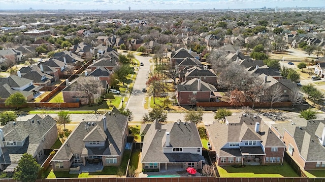 birds eye view of property with a residential view