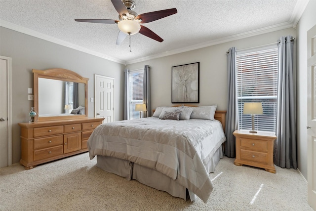 bedroom with crown molding, a textured ceiling, and light colored carpet