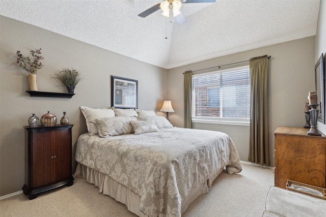 bedroom with a textured ceiling, light carpet, a ceiling fan, baseboards, and vaulted ceiling