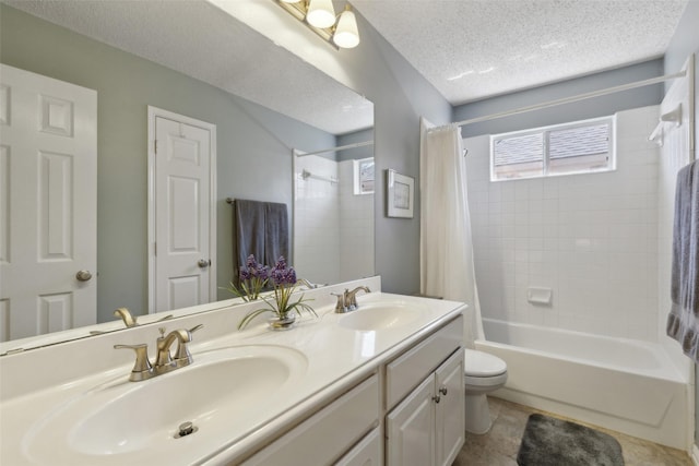 full bath featuring a textured ceiling, plenty of natural light, and a sink