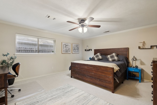 carpeted bedroom featuring visible vents, a ceiling fan, baseboards, and ornamental molding