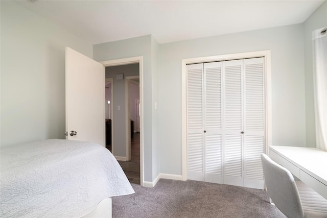 bedroom with carpet floors, a closet, and baseboards