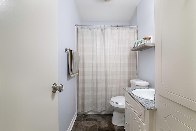 bathroom with baseboards, vanity, toilet, and a shower with curtain