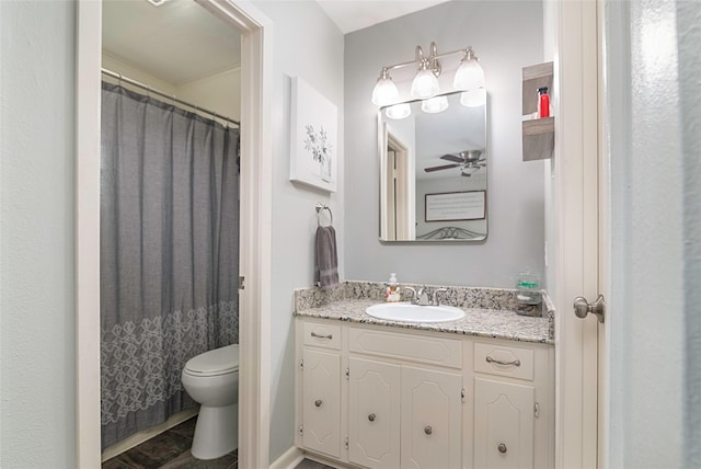 full bath with vanity, toilet, and a ceiling fan