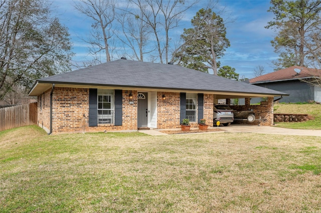 ranch-style home featuring an attached carport, brick siding, fence, driveway, and a front lawn