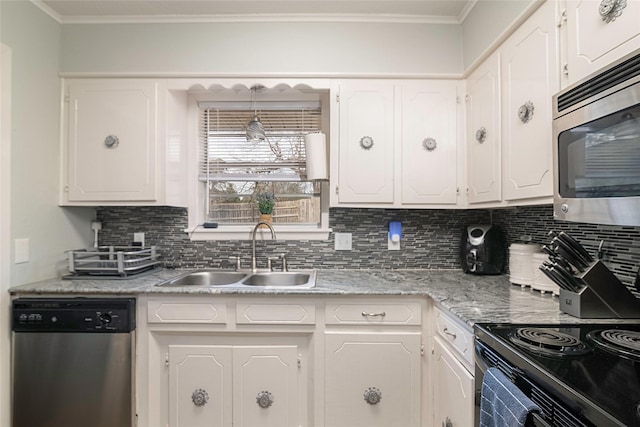 kitchen featuring white cabinetry, stainless steel appliances, and a sink