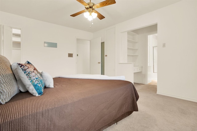 bedroom with baseboards, a ceiling fan, and light colored carpet