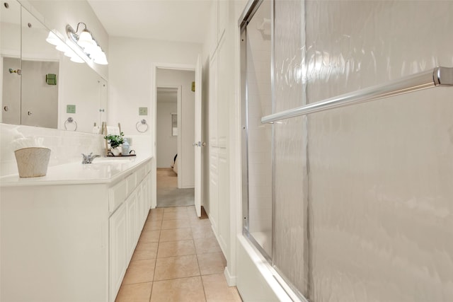 full bathroom featuring tasteful backsplash, vanity, and tile patterned floors