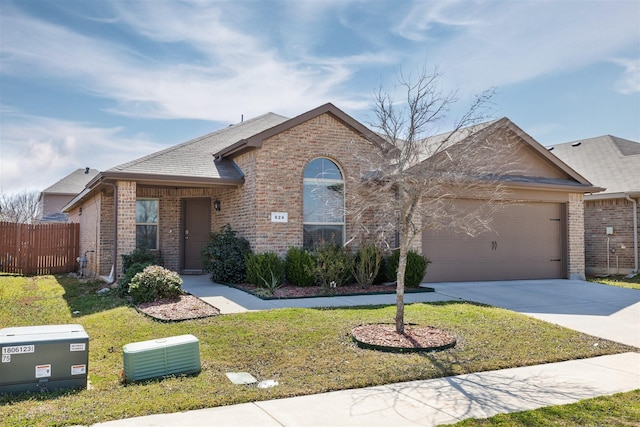 view of front of property with concrete driveway, brick siding, fence, and an attached garage