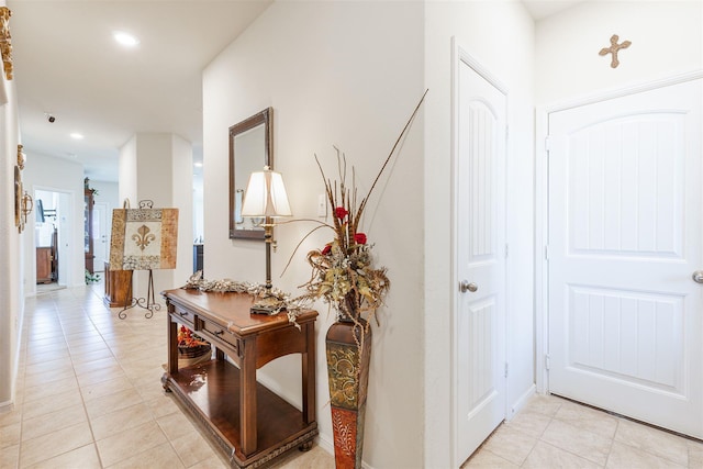 corridor with light tile patterned floors and recessed lighting