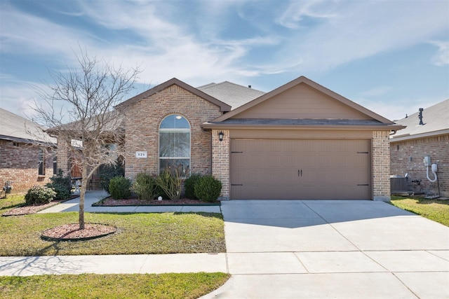 view of front of property with driveway, an attached garage, and brick siding