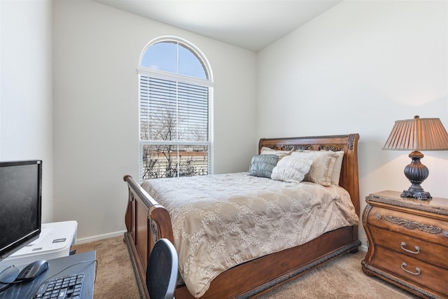 carpeted bedroom featuring baseboards