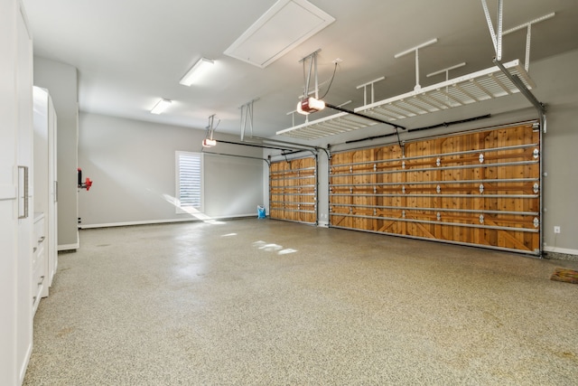 garage featuring baseboards and a garage door opener