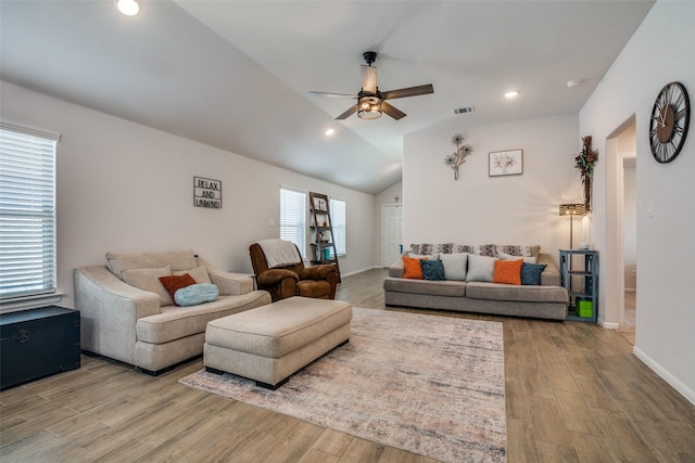 living area with baseboards, a ceiling fan, wood finished floors, vaulted ceiling, and recessed lighting