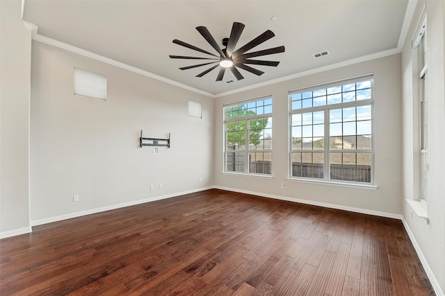 unfurnished room with dark wood-style flooring, visible vents, ornamental molding, ceiling fan, and baseboards