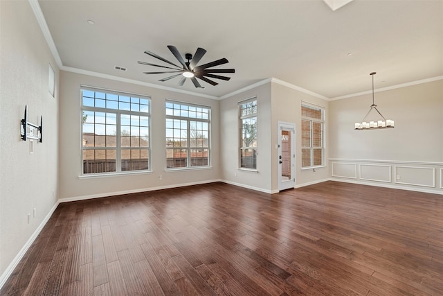 unfurnished room with visible vents, ornamental molding, dark wood-style flooring, and ceiling fan with notable chandelier