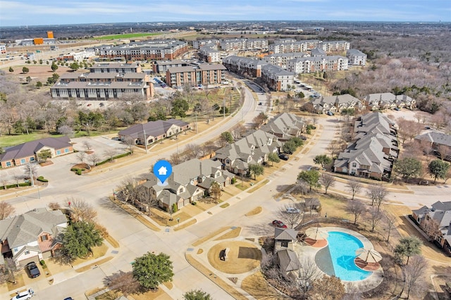 birds eye view of property with a residential view