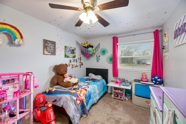 bedroom with ceiling fan and carpet flooring