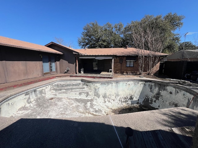 view of pool featuring an empty pool and a patio area