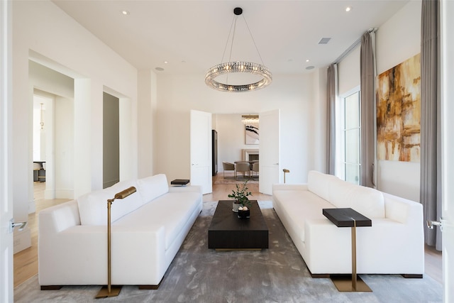 living area with recessed lighting and visible vents