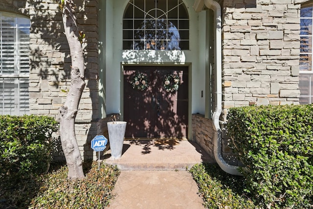 property entrance with brick siding