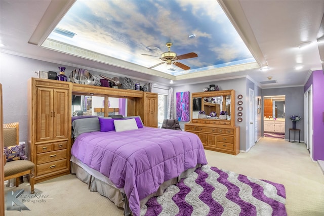 bedroom with ornamental molding, a raised ceiling, light carpet, and a ceiling fan