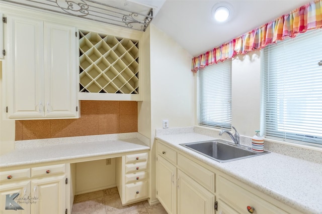 20 Glen Abbey St, Abilene, TX 79606 - kitchen featuring a sink, light countertops, and decorative backsplash