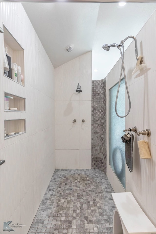 full bath featuring tiled shower