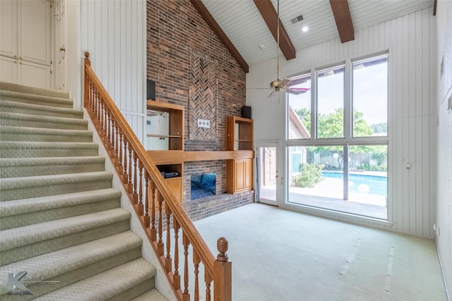 20 Glen Abbey St, Abilene, TX 79606 - stairs with a brick fireplace, carpet floors, high vaulted ceiling, wooden ceiling with exposed beams, and ceiling fan