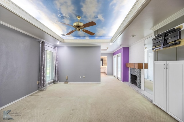 20 Glen Abbey St, Abilene, TX 79606 - unfurnished living room with a raised ceiling, a ceiling fan, carpet flooring, healthy amount of natural light, and ornamental molding