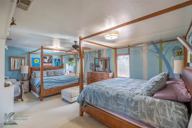 carpeted bedroom featuring visible vents