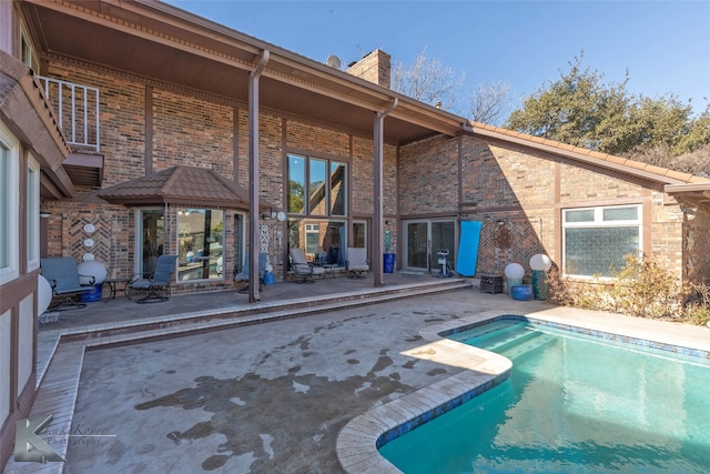 outdoor pool with a patio