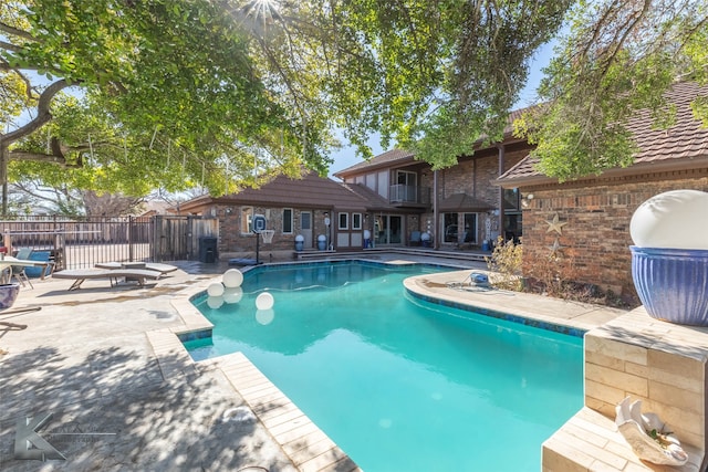 view of pool featuring area for grilling, a patio area, fence, and a fenced in pool