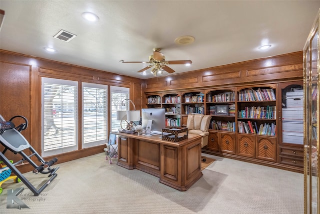 office space with ceiling fan, recessed lighting, light carpet, wood walls, and visible vents