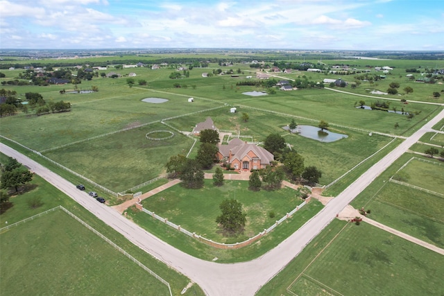 birds eye view of property featuring a rural view