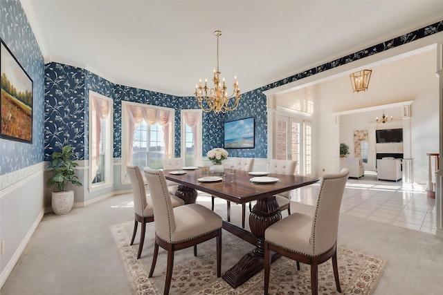 tiled dining area with crown molding, plenty of natural light, an inviting chandelier, and wallpapered walls