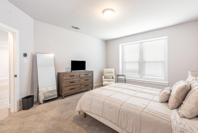 bedroom with carpet and visible vents