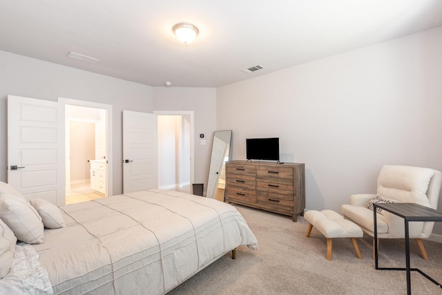 bedroom with visible vents and light colored carpet