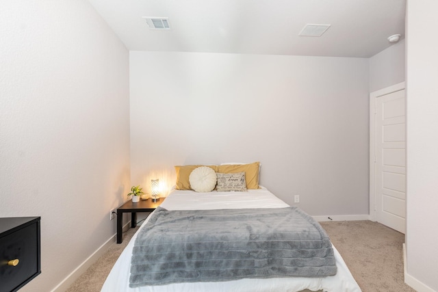 bedroom with carpet flooring, visible vents, and baseboards