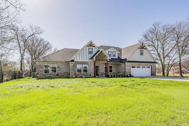 craftsman house with driveway, a garage, a front lawn, board and batten siding, and brick siding