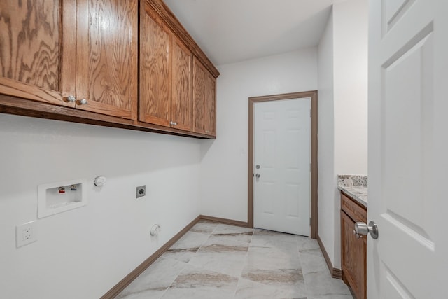 washroom featuring marble finish floor, hookup for a washing machine, cabinet space, hookup for an electric dryer, and gas dryer hookup