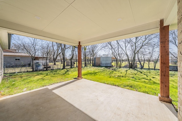 view of patio / terrace featuring fence