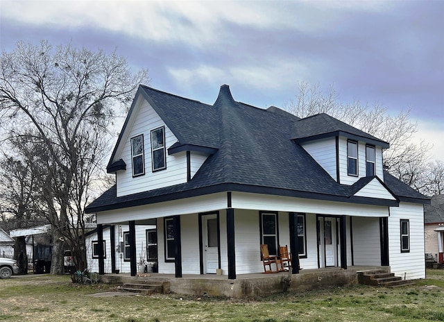 view of front of house featuring covered porch and roof with shingles